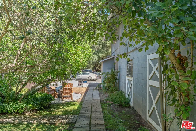 a backyard of a house with lots of green space