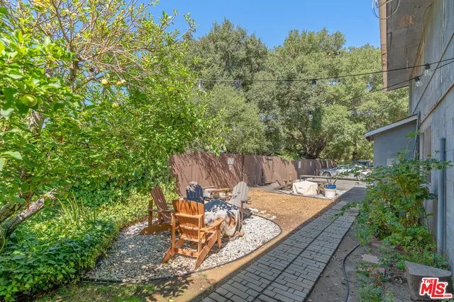 a view of a backyard with sitting area