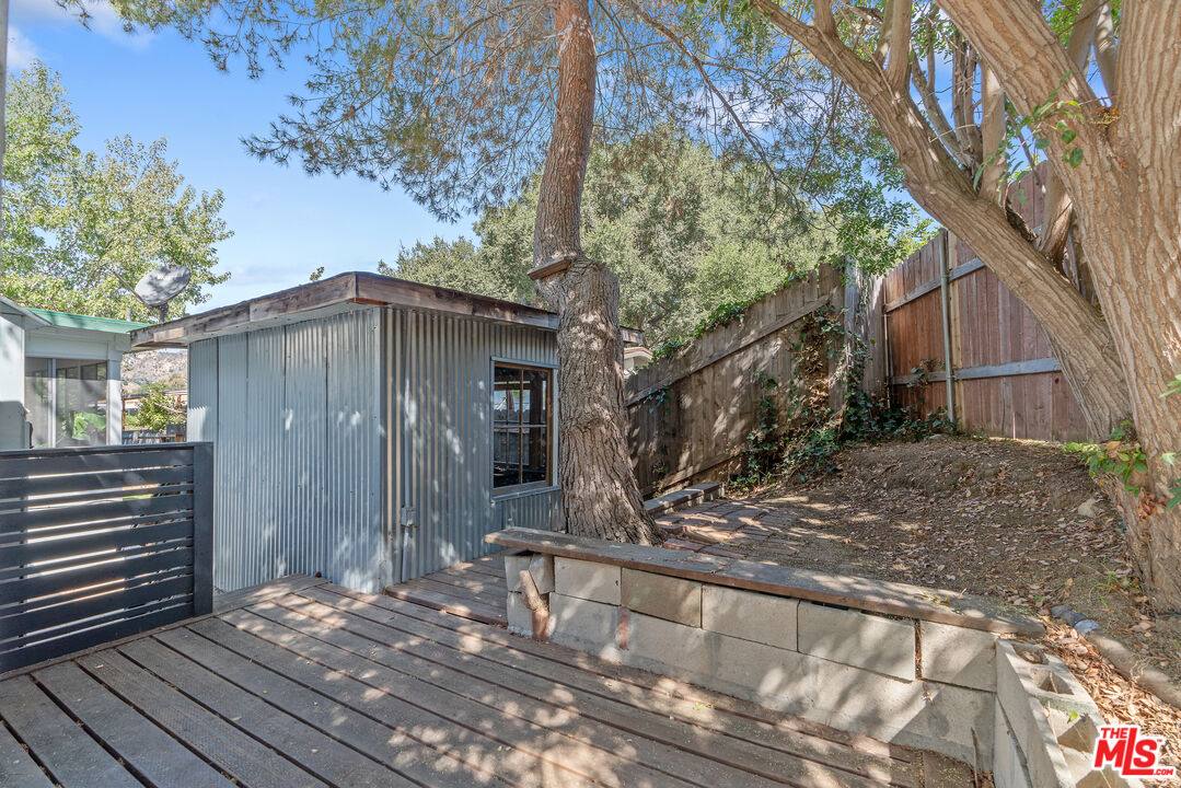 1667 Las Virgenes Canyon Road, Unit 9 Calabasas, CA 91302 - Photo 20 of 29 a view of a house with a yard