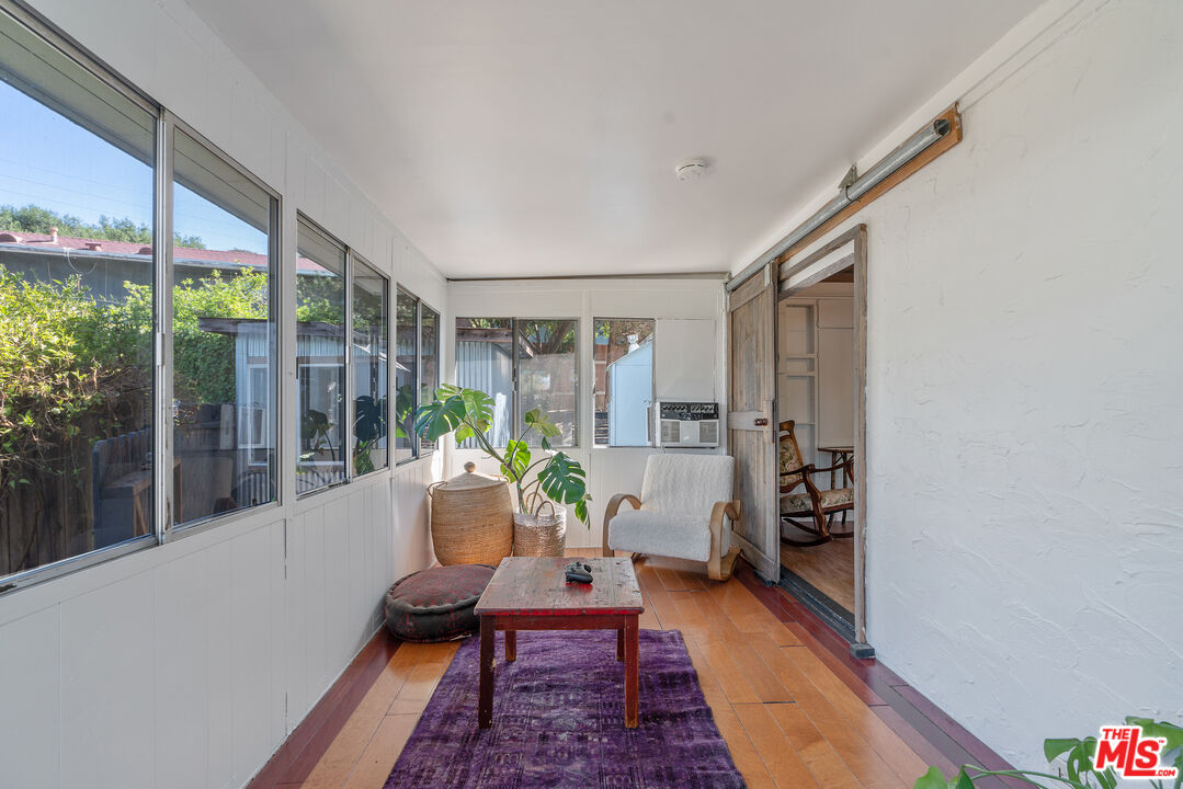 1667 Las Virgenes Canyon Road, Unit 9 Calabasas, CA 91302 - Photo 6 of 29 a living room with furniture and a potted plant