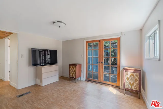 a view of livingroom with furniture and flat screen tv