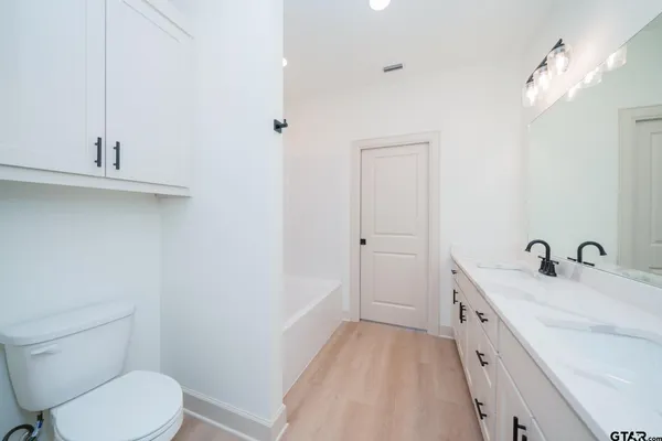 a view of a room with a ceiling fan