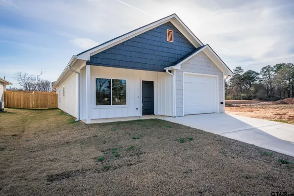 a view of a kitchen with a sink and a window