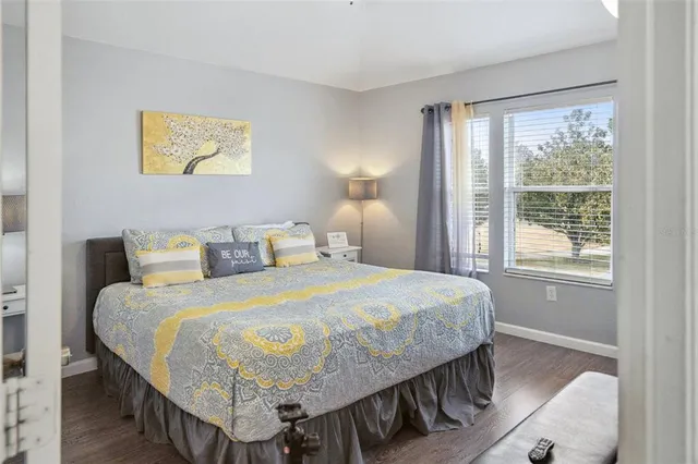 a bedroom with a large bed and a couch