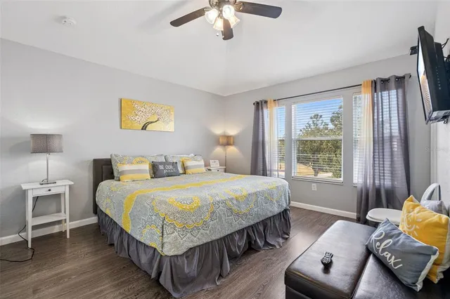 a bedroom with a large bed and a couch