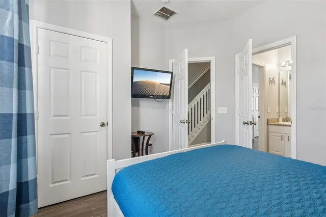 a bathroom with a granite countertop sink and a bathtub