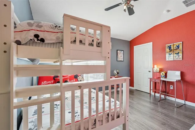 a view of a swimming pool with a yard