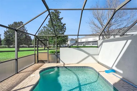 an aerial view of a swimming pool and outdoor space