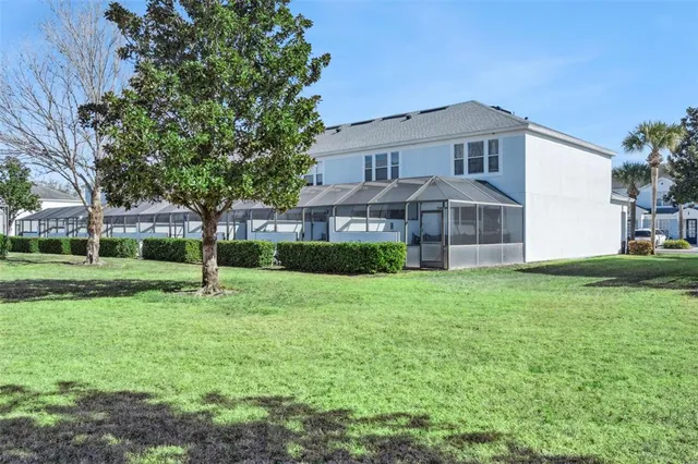 a view of a room with furniture and potted plant