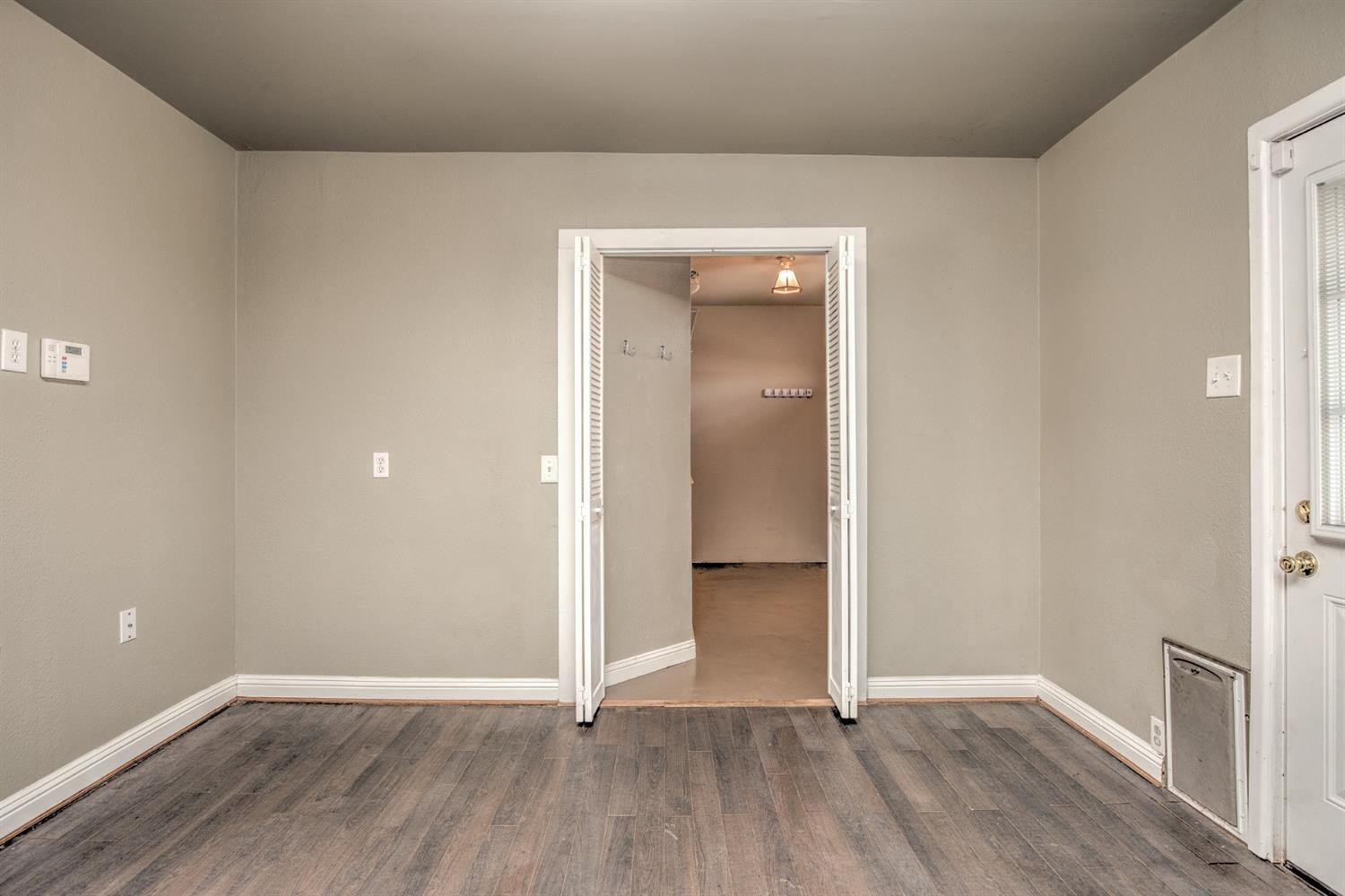 3008 30th Street Lubbock, TX 79410 - Photo 12 of 29 wooden floor in an empty room