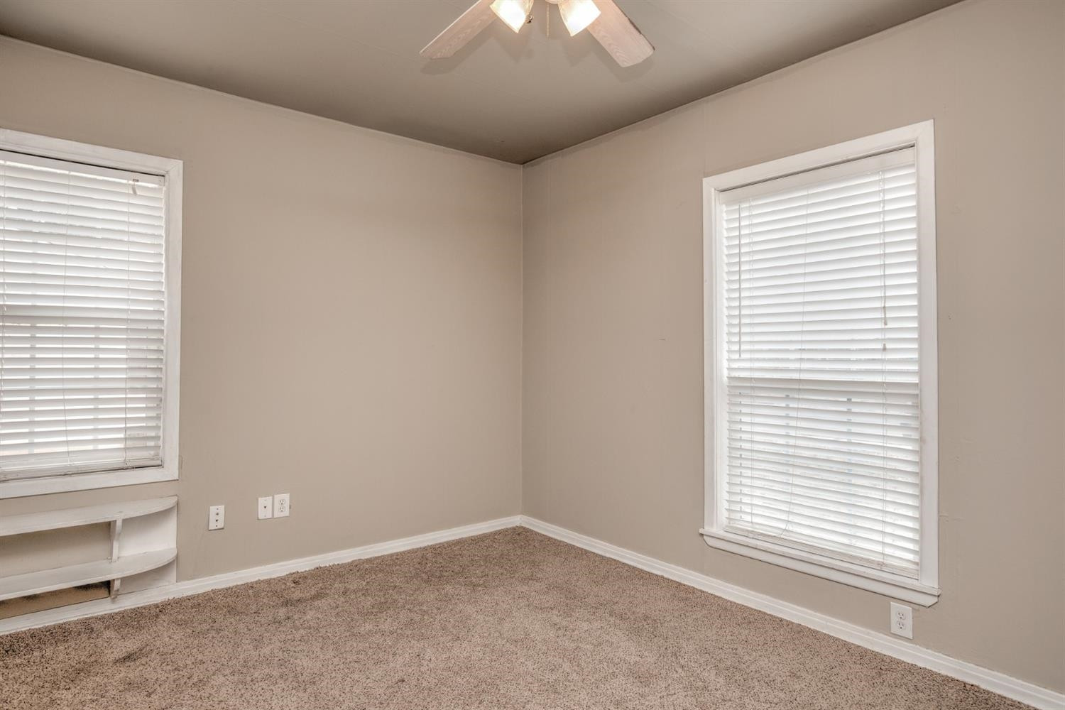 3008 30th Street Lubbock, TX 79410 - Photo 13 of 29 an empty room with a window