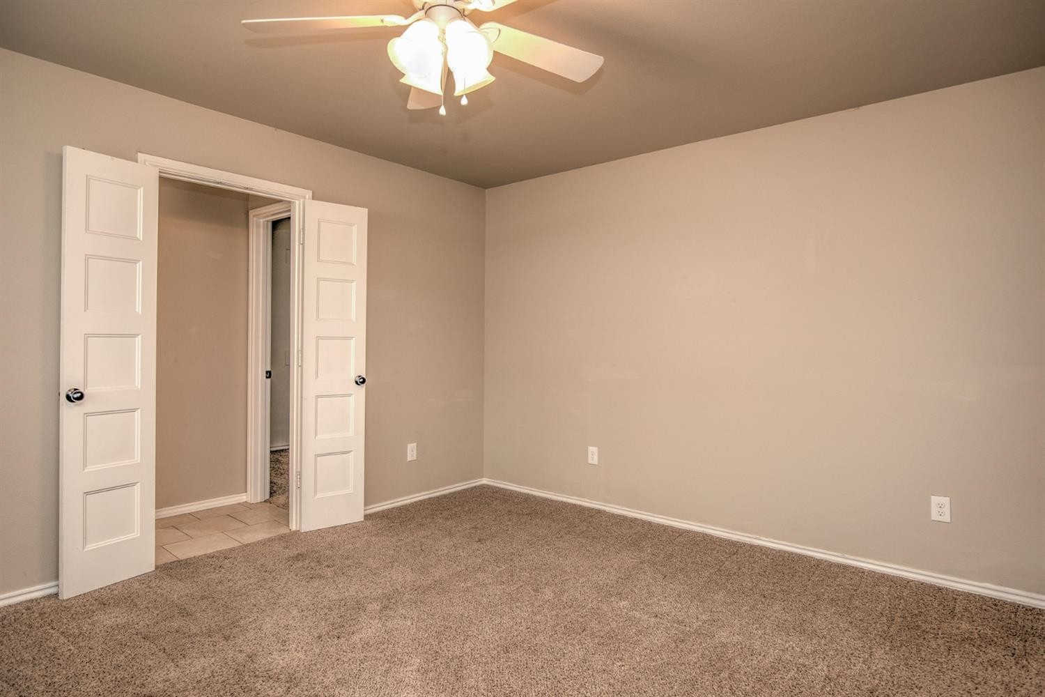 3008 30th Street Lubbock, TX 79410 - Photo 18 of 29 a view of an empty room with a chandelier fan