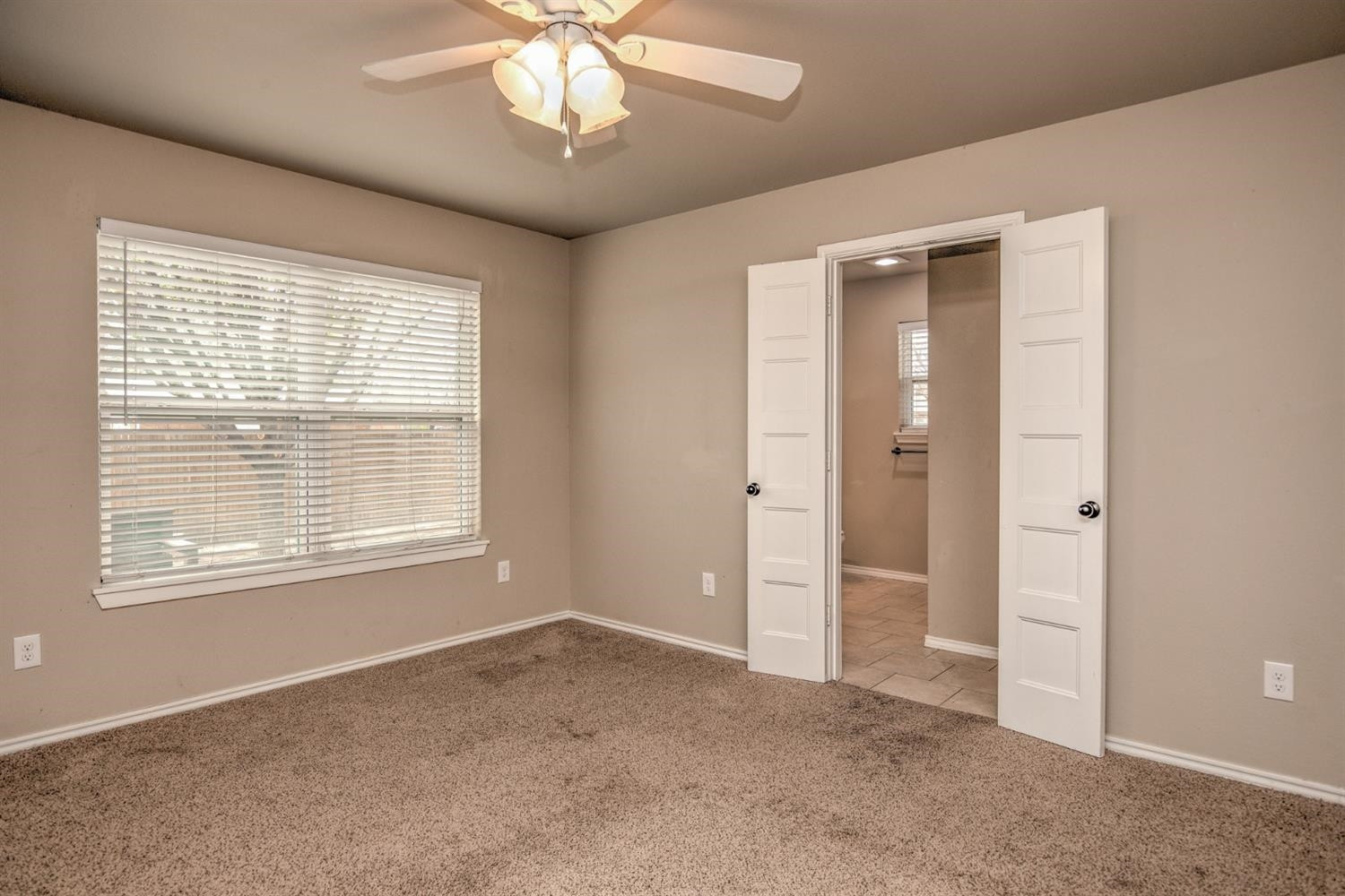 3008 30th Street Lubbock, TX 79410 - Photo 19 of 29 a view of an empty room with a window