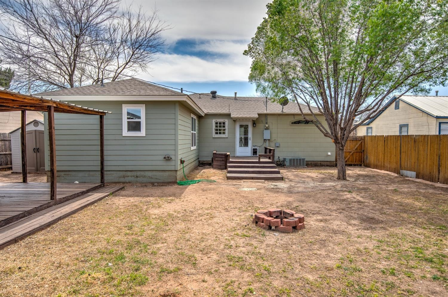 3008 30th Street Lubbock, TX 79410 - Photo 23 of 29 a view of a house with a yard covered in snow