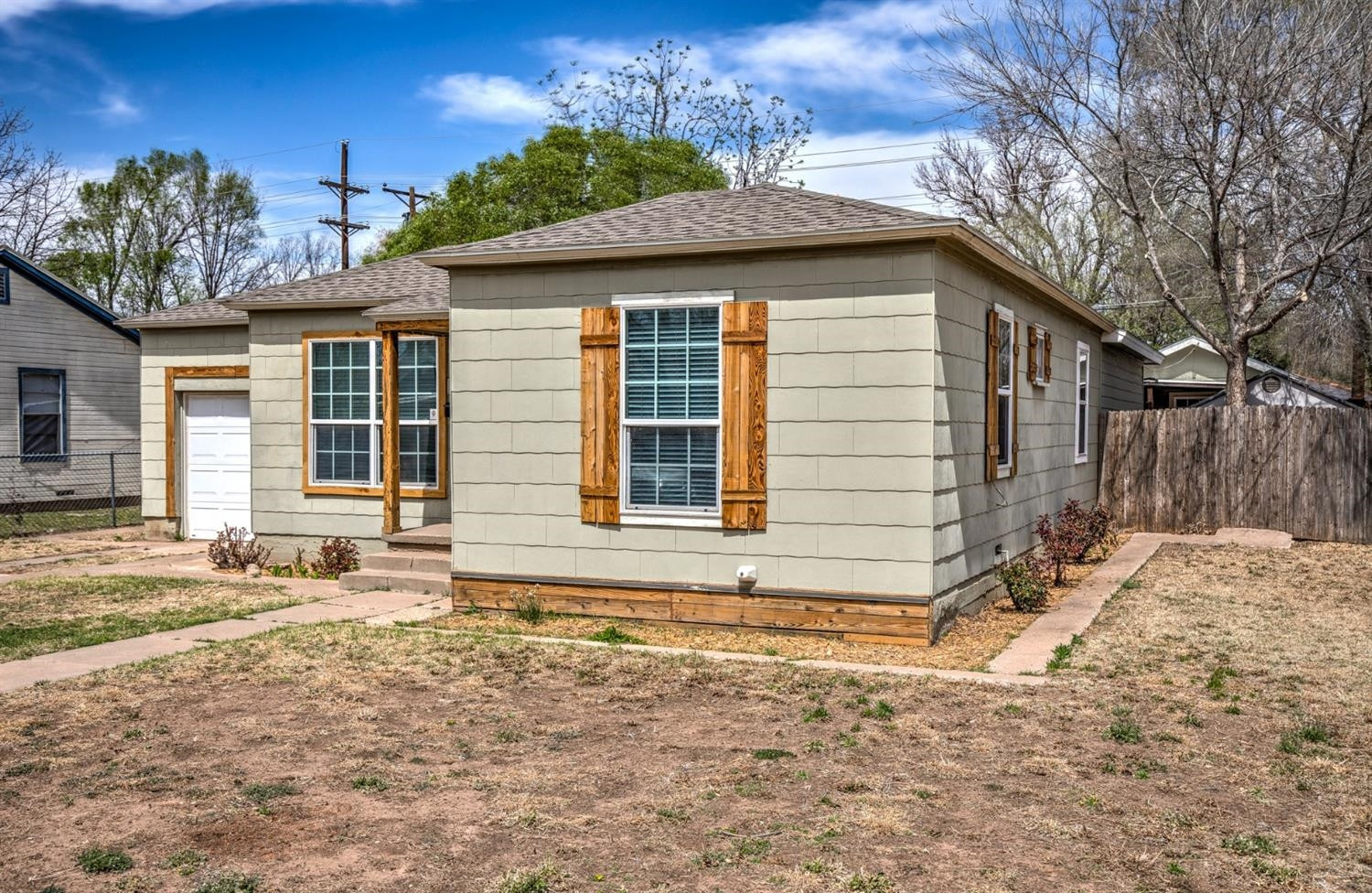 3008 30th Street Lubbock, TX 79410 - Photo 28 of 29 a front view of a house with a yard