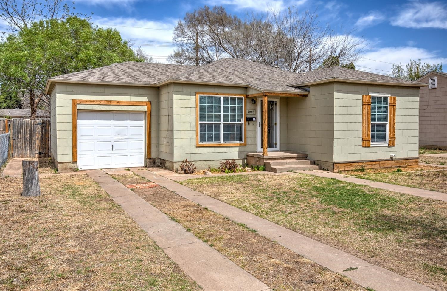 3008 30th Street Lubbock, TX 79410 - Photo 29 of 29 a front view of a house with a yard