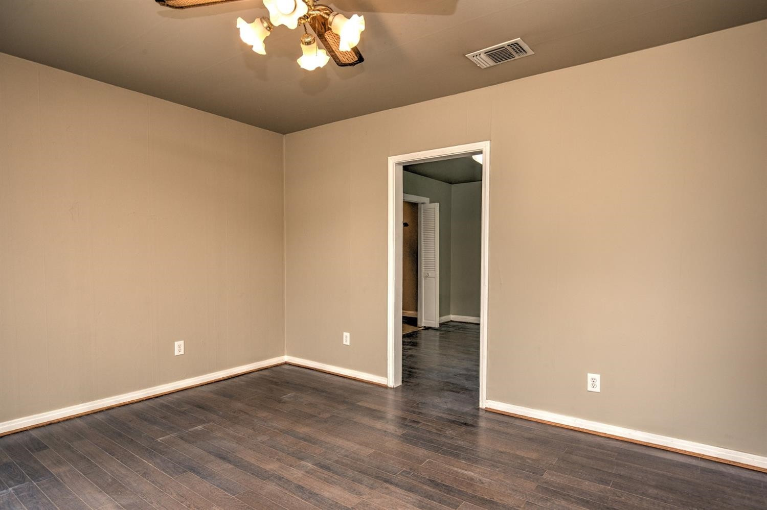 3008 30th Street Lubbock, TX 79410 - Photo 4 of 29 a view of an empty room with wooden floor