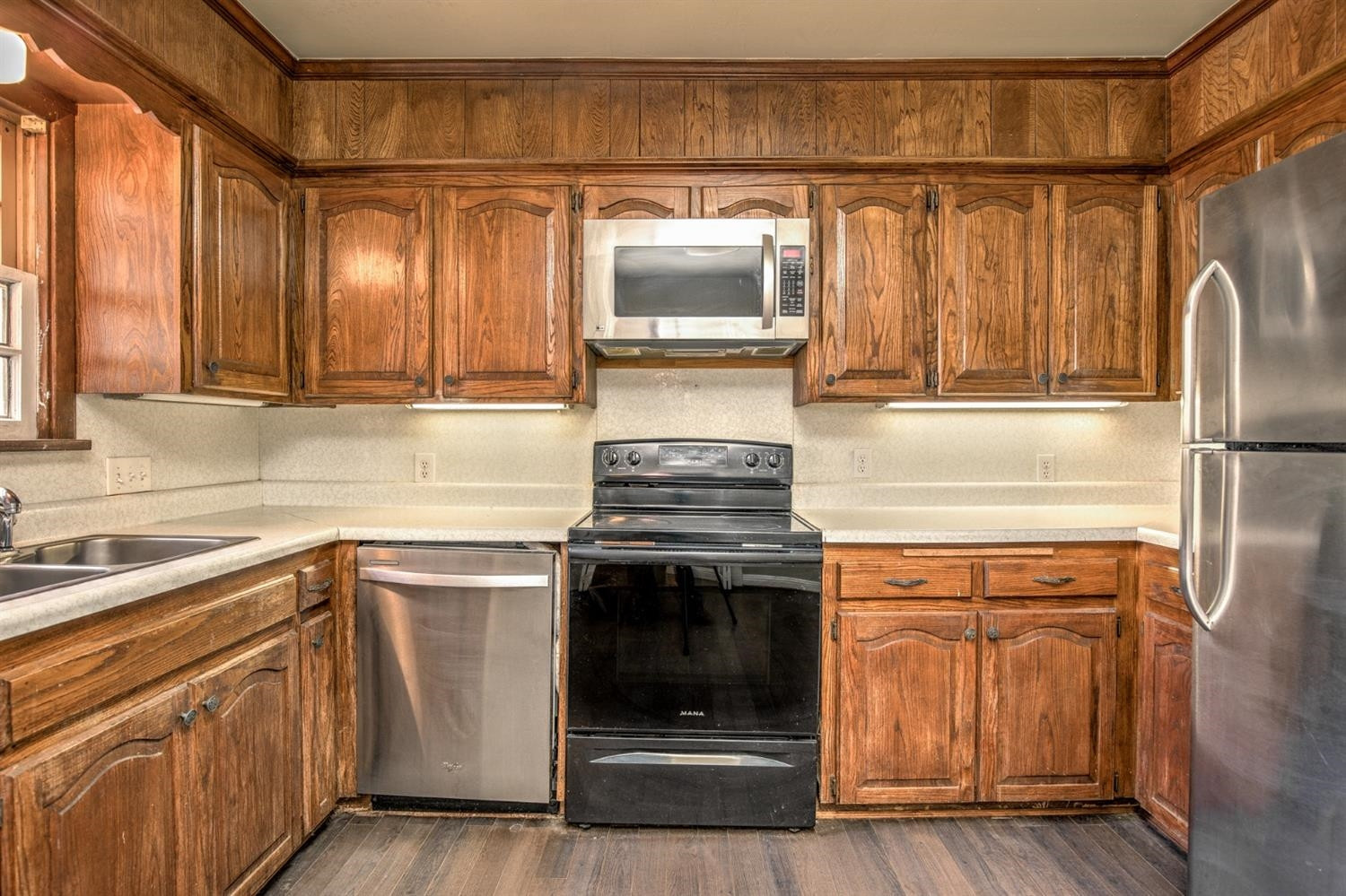 3008 30th Street Lubbock, TX 79410 - Photo 7 of 29 a kitchen with granite countertop a stove and a sink