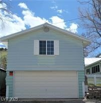 316 Cedar Street Pioche, NV 89043 - Photo 4 of 15 View of property exterior with an attached garage