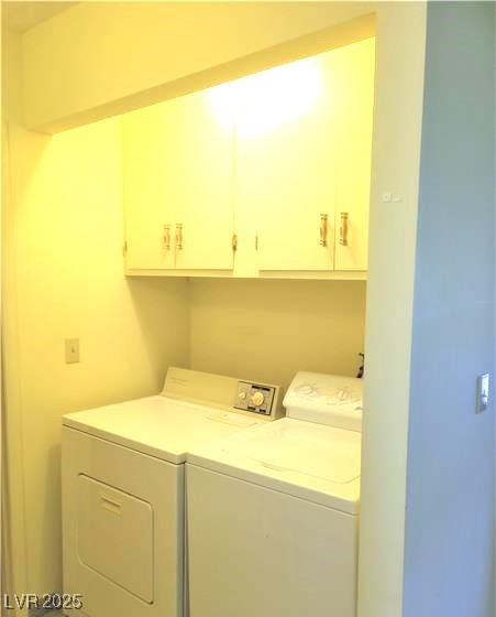 316 Cedar Street Pioche, NV 89043 - Photo 6 of 15 Laundry room with cabinet space and washing machine and clothes dryer