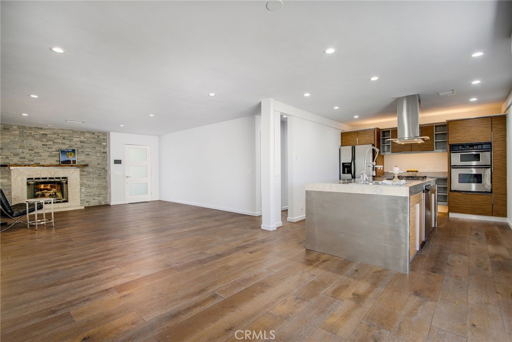 7320 Sherwood Road Joshua Tree, CA 92252 - Photo 12 of 44 a view of kitchen with furniture and wooden floor