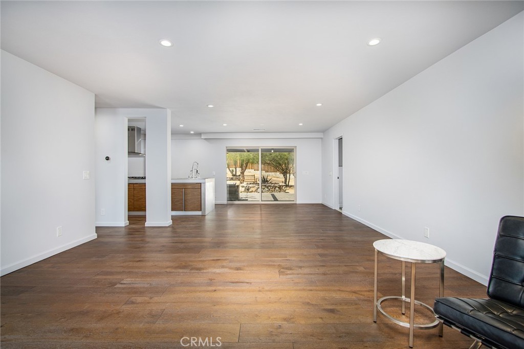 7320 Sherwood Road Joshua Tree, CA 92252 - Photo 13 of 44 a view of a kitchen with furniture and wooden floor