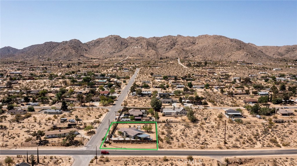 7320 Sherwood Road Joshua Tree, CA 92252 - Photo 3 of 44 an aerial view of residential house and sandy dunes