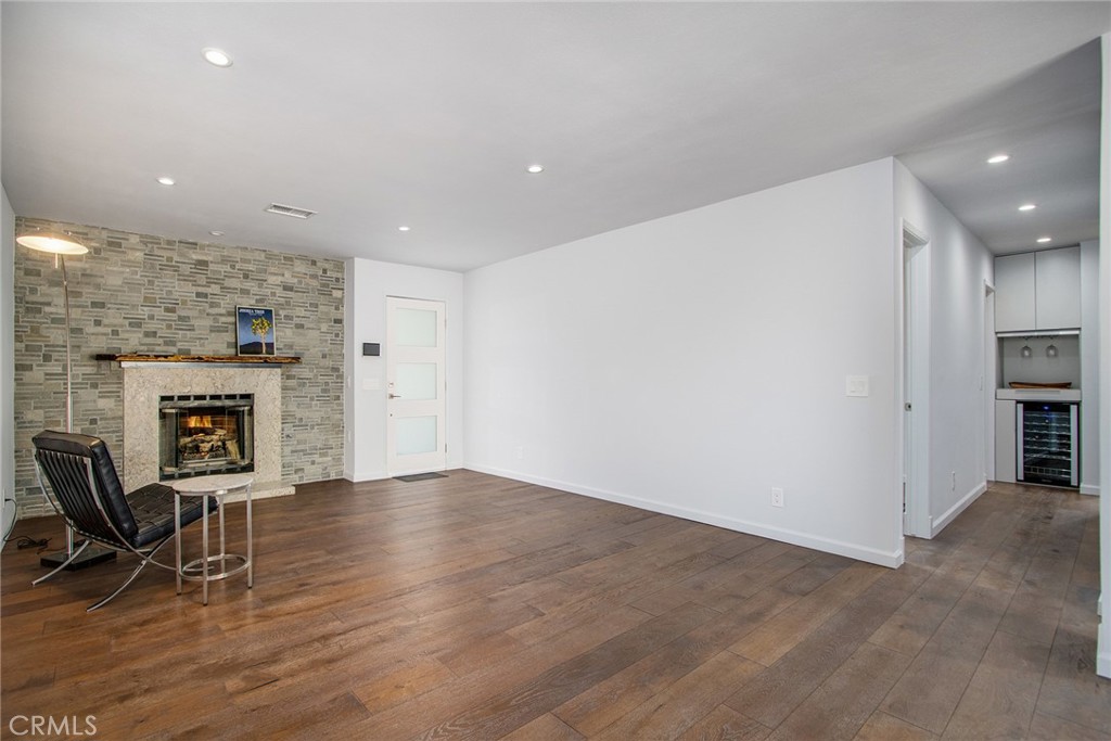 7320 Sherwood Road Joshua Tree, CA 92252 - Photo 9 of 44 an empty room with furniture and a fireplace