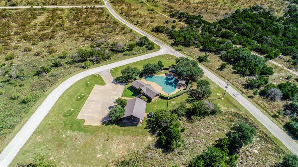 170 Colonial Drive Graford, TX 76449 - Photo 11 of 12 an aerial view of a house with a yard and lake view