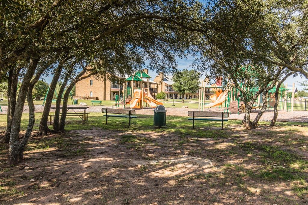 170 Colonial Drive Graford, TX 76449 - Photo 7 of 12 a backyard of a house with lots of green space