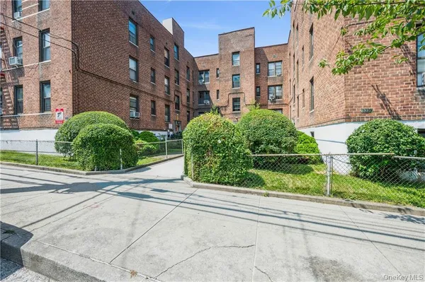 a view of a garden from a brick building