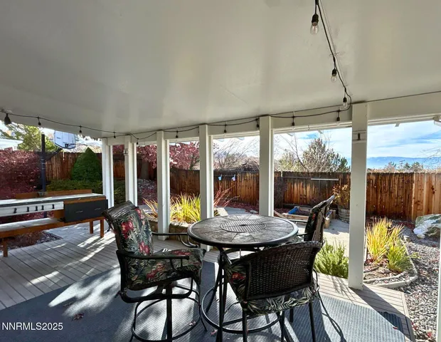 a view of a dining room with furniture wooden floor and chandelier
