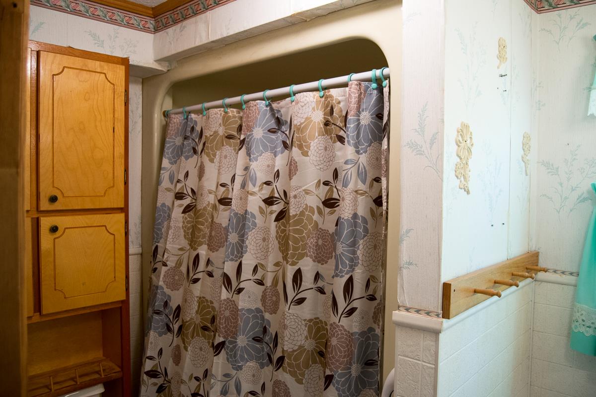 160 Excell Road Clarksville, TN 37043 - Photo 13 of 30 a bathroom with a shower and a mirror
