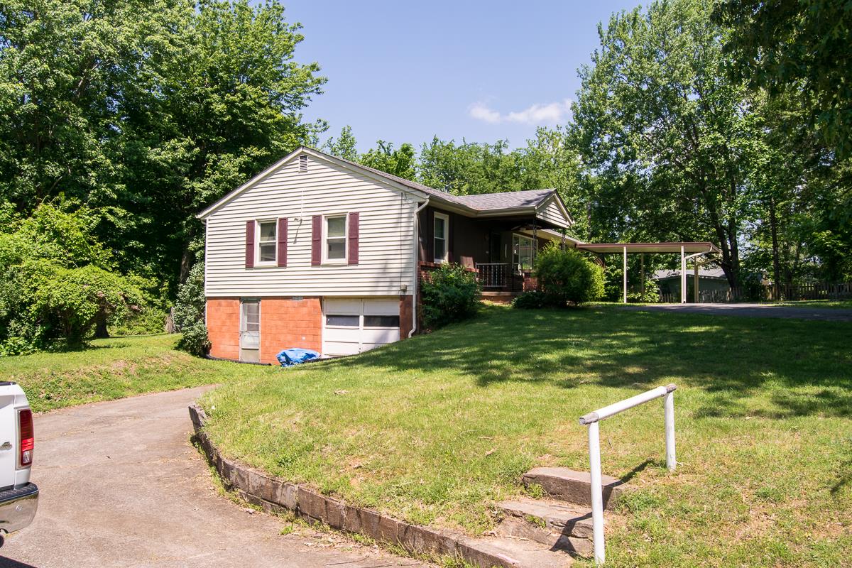 160 Excell Road Clarksville, TN 37043 - Photo 22 of 30 a view of a house with a yard patio and a garden