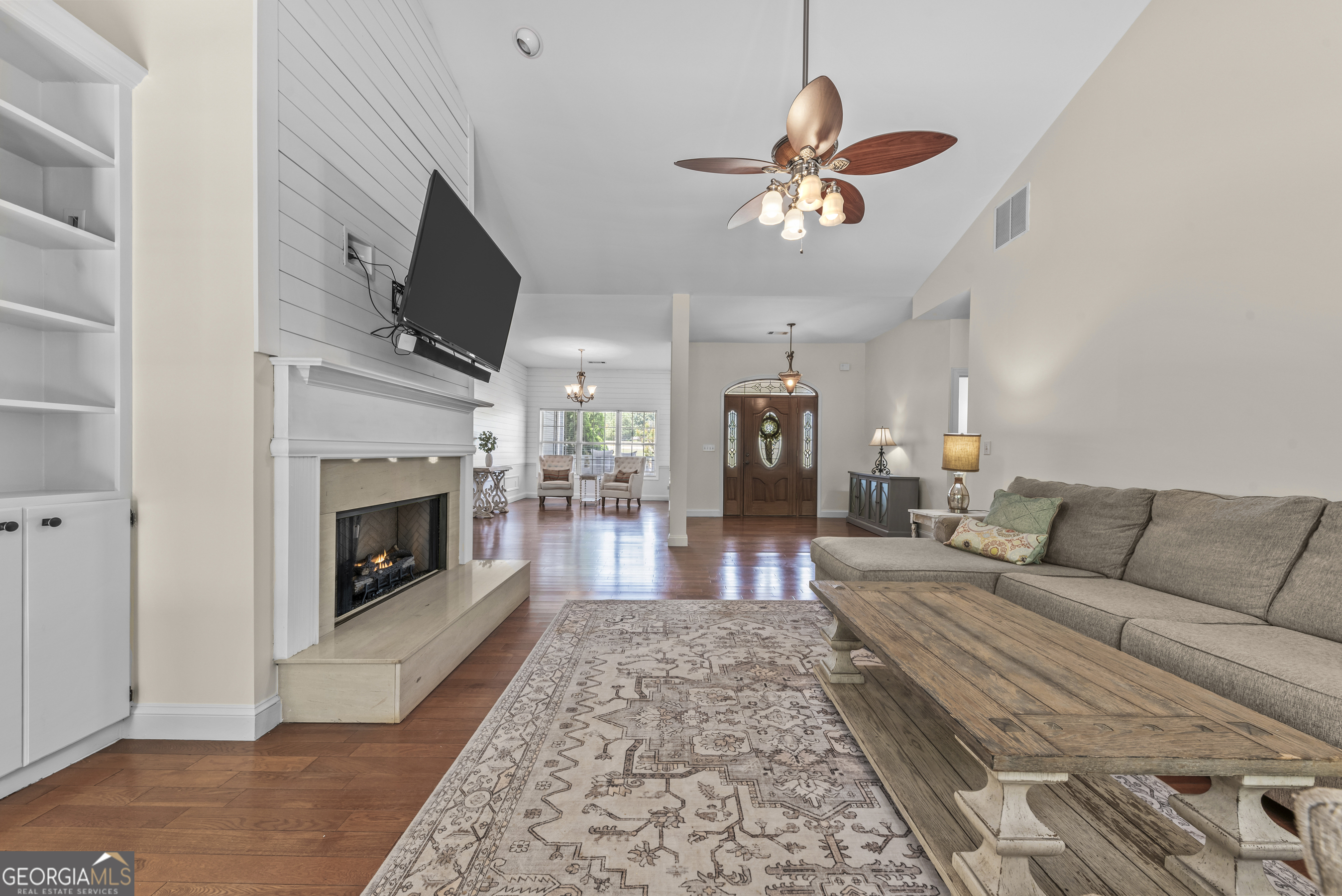 180 Cooper Road Social Circle, GA 30025 - Photo 14 of 51 a living room with furniture and a fireplace