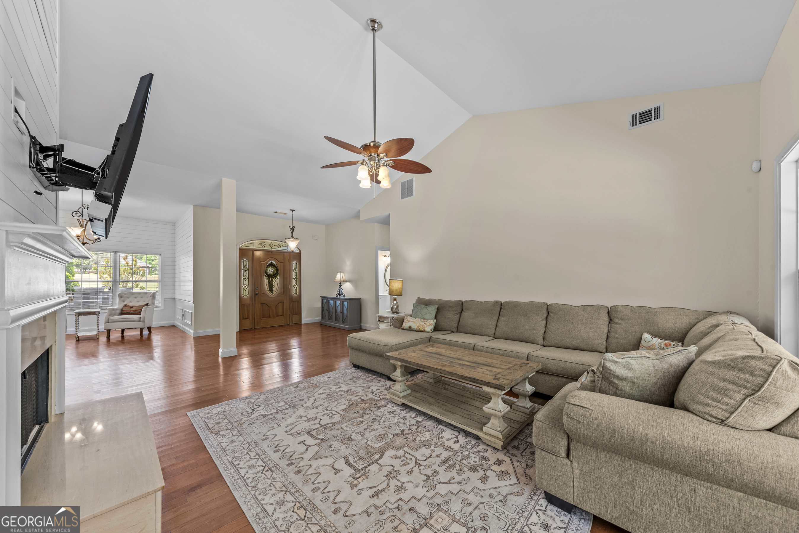 180 Cooper Road Social Circle, GA 30025 - Photo 16 of 51 a living room with furniture and a wooden floor