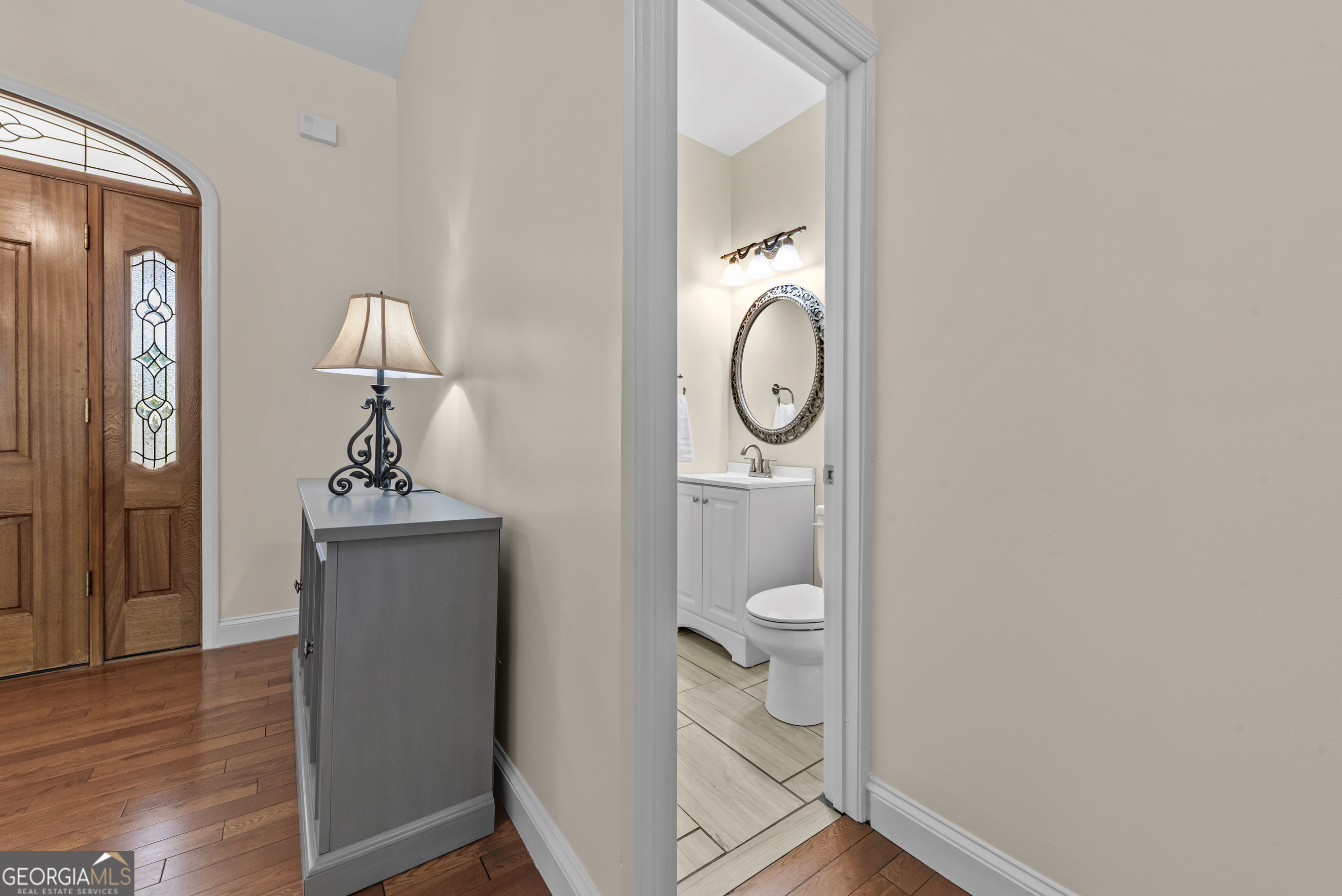 180 Cooper Road Social Circle, GA 30025 - Photo 17 of 51 a bathroom with a toilet a sink and mirror