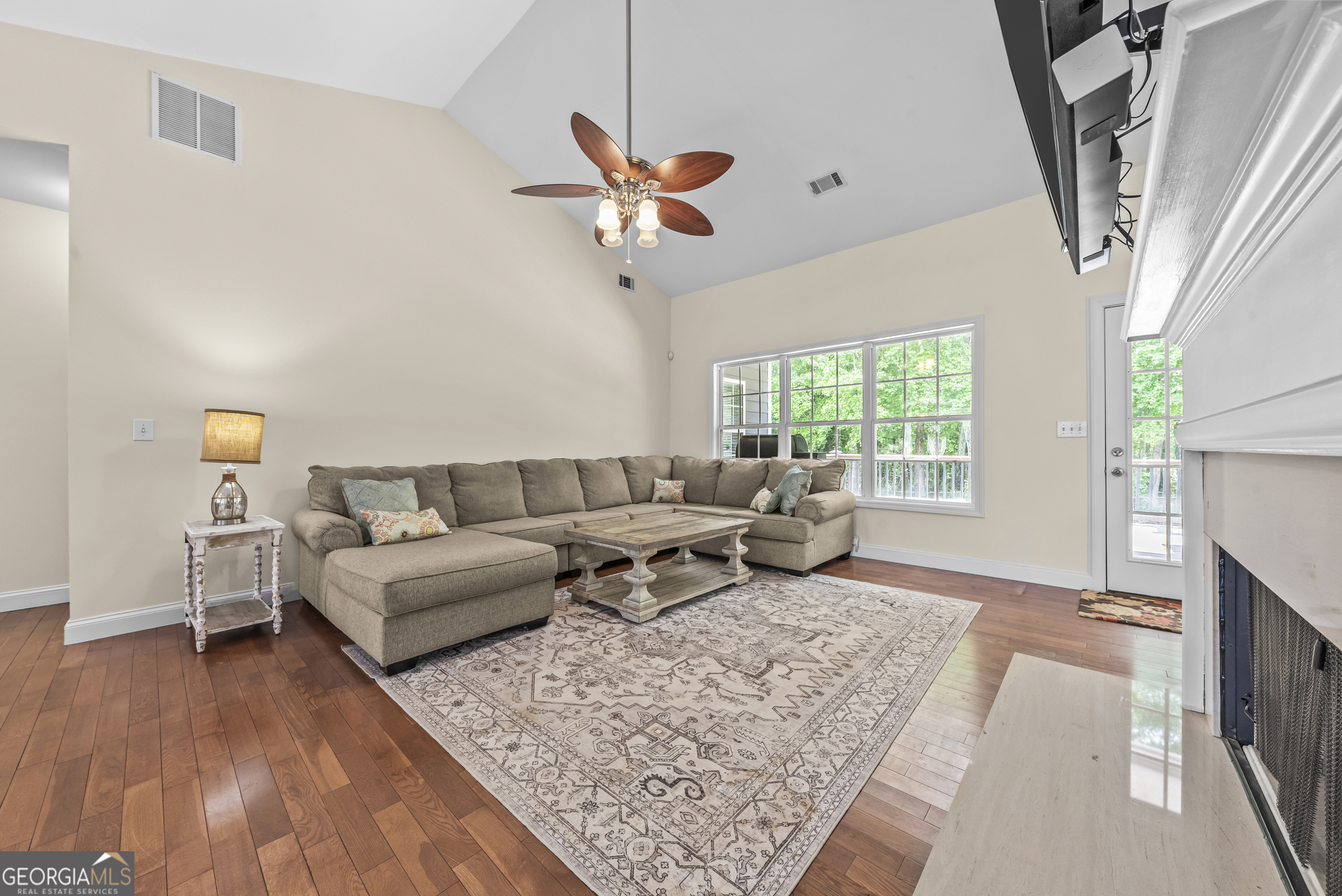 180 Cooper Road Social Circle, GA 30025 - Photo 18 of 51 a living room with furniture and a large window