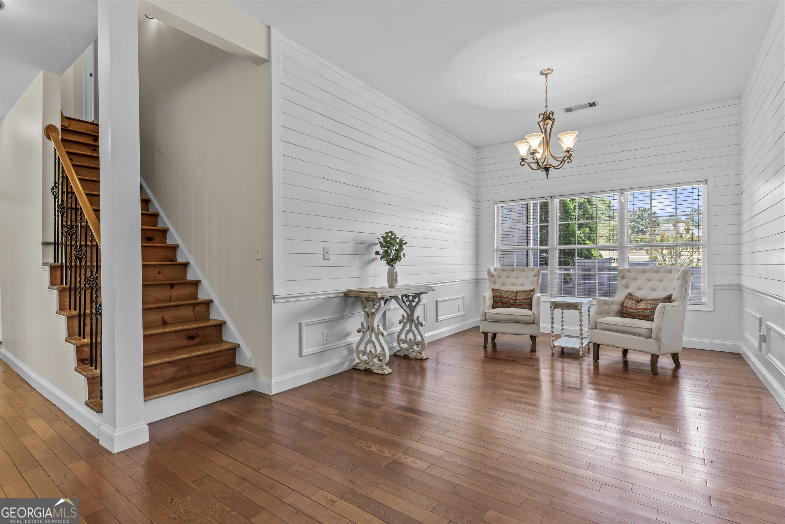 180 Cooper Road Social Circle, GA 30025 - Photo 19 of 51 a view of a dining room with furniture wooden floor and chandelier