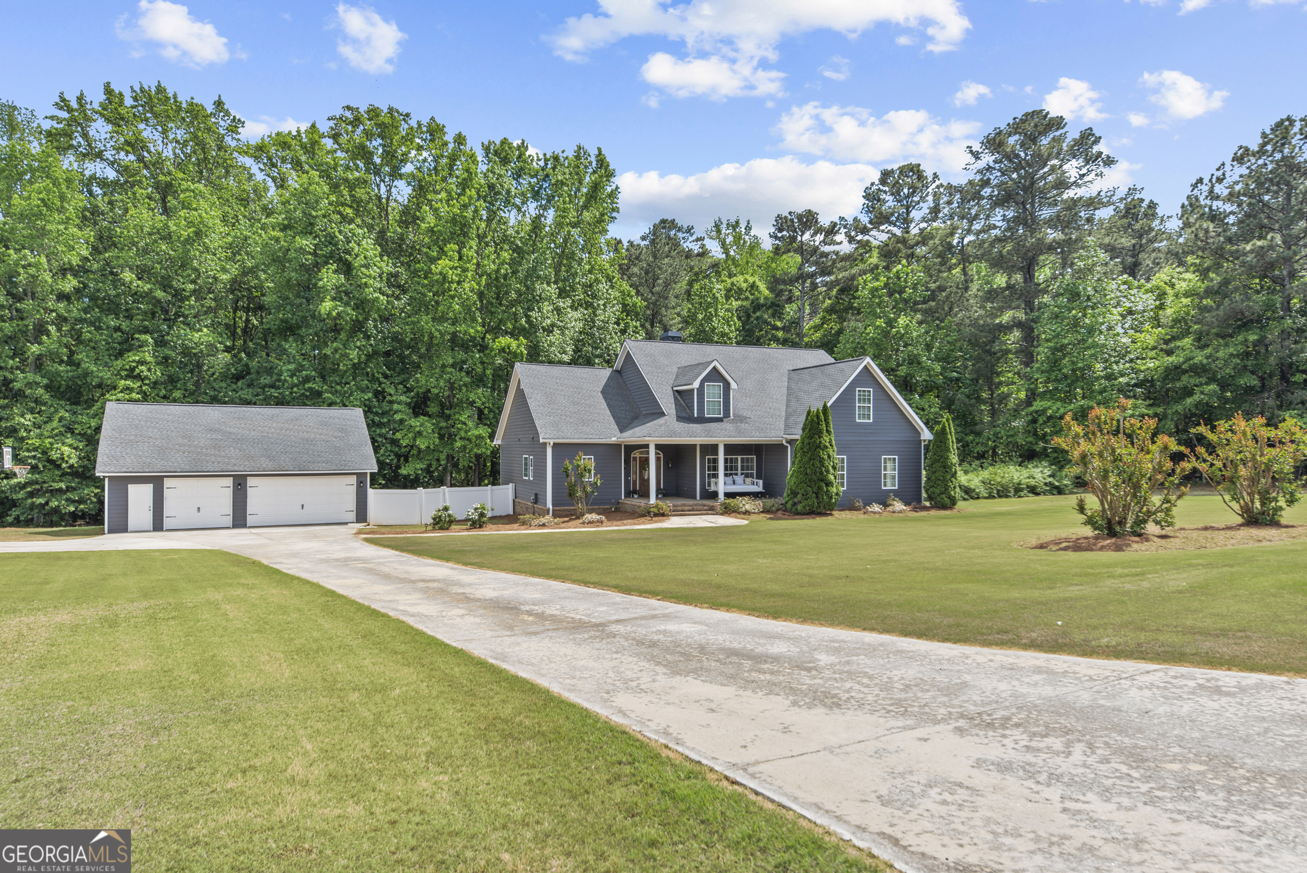 180 Cooper Road Social Circle, GA 30025 - Photo 2 of 51 a front view of a house with a garden