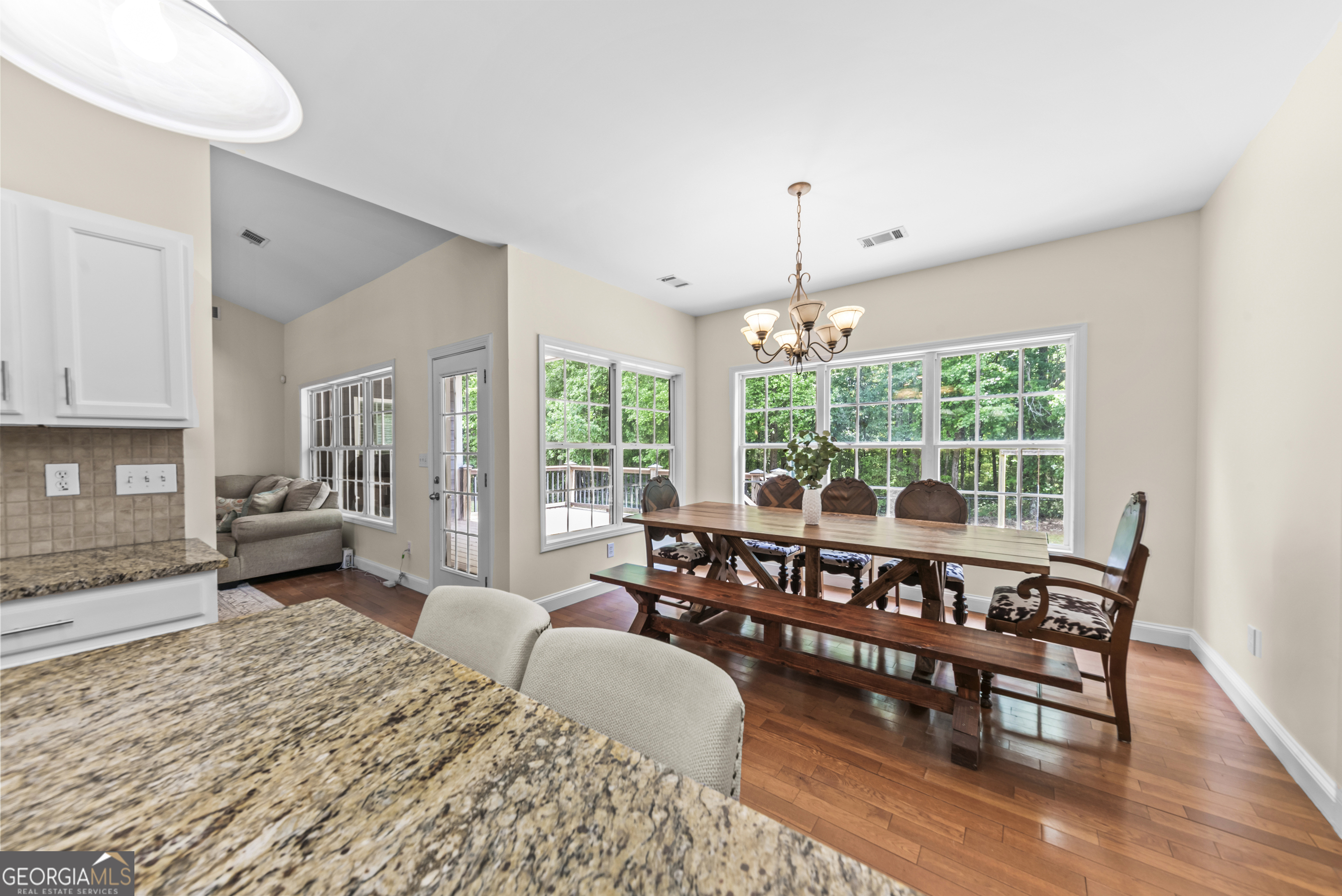 180 Cooper Road Social Circle, GA 30025 - Photo 23 of 51 a living room with furniture and a large window
