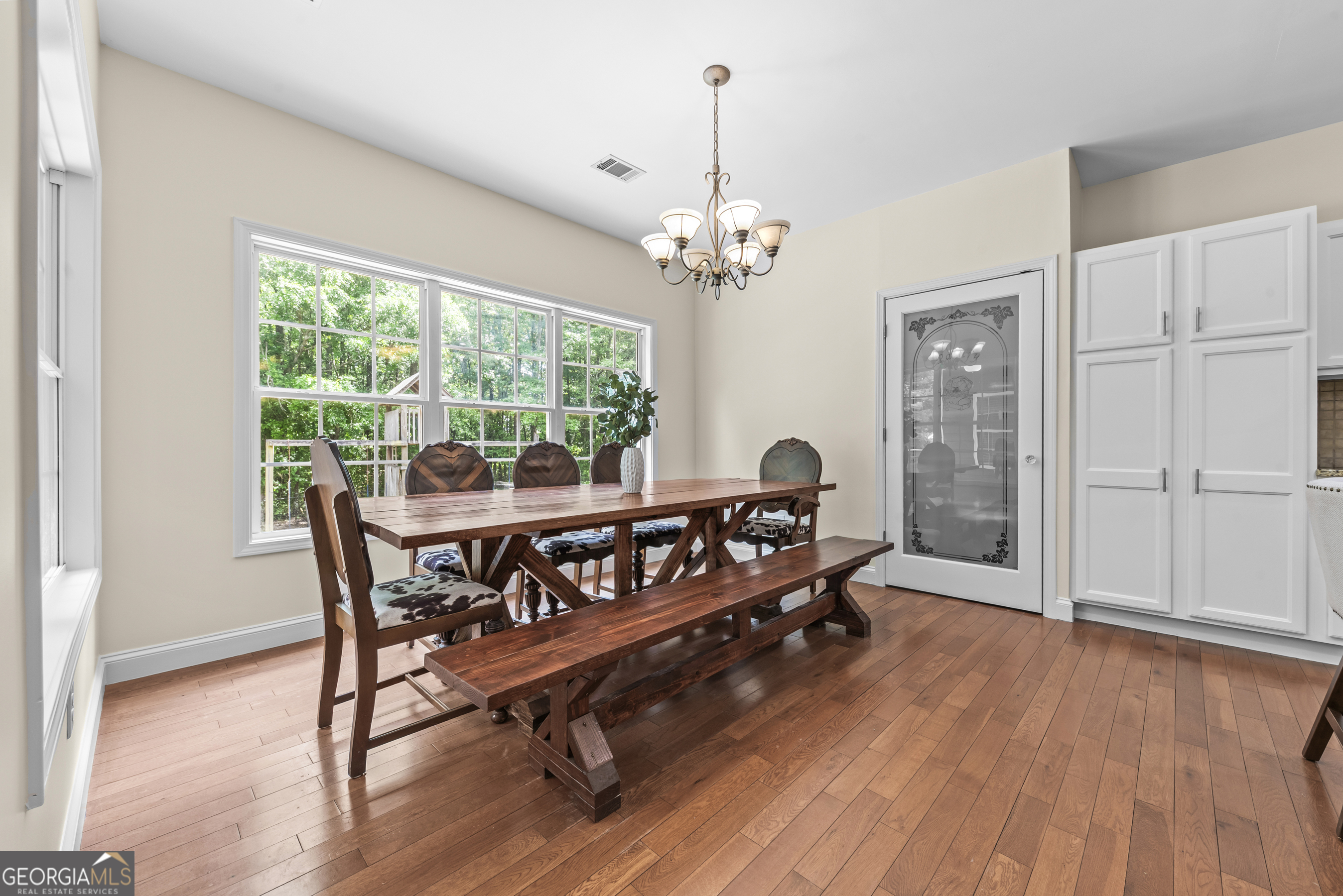 180 Cooper Road Social Circle, GA 30025 - Photo 26 of 51 a view of a dining room with furniture window and wooden floor