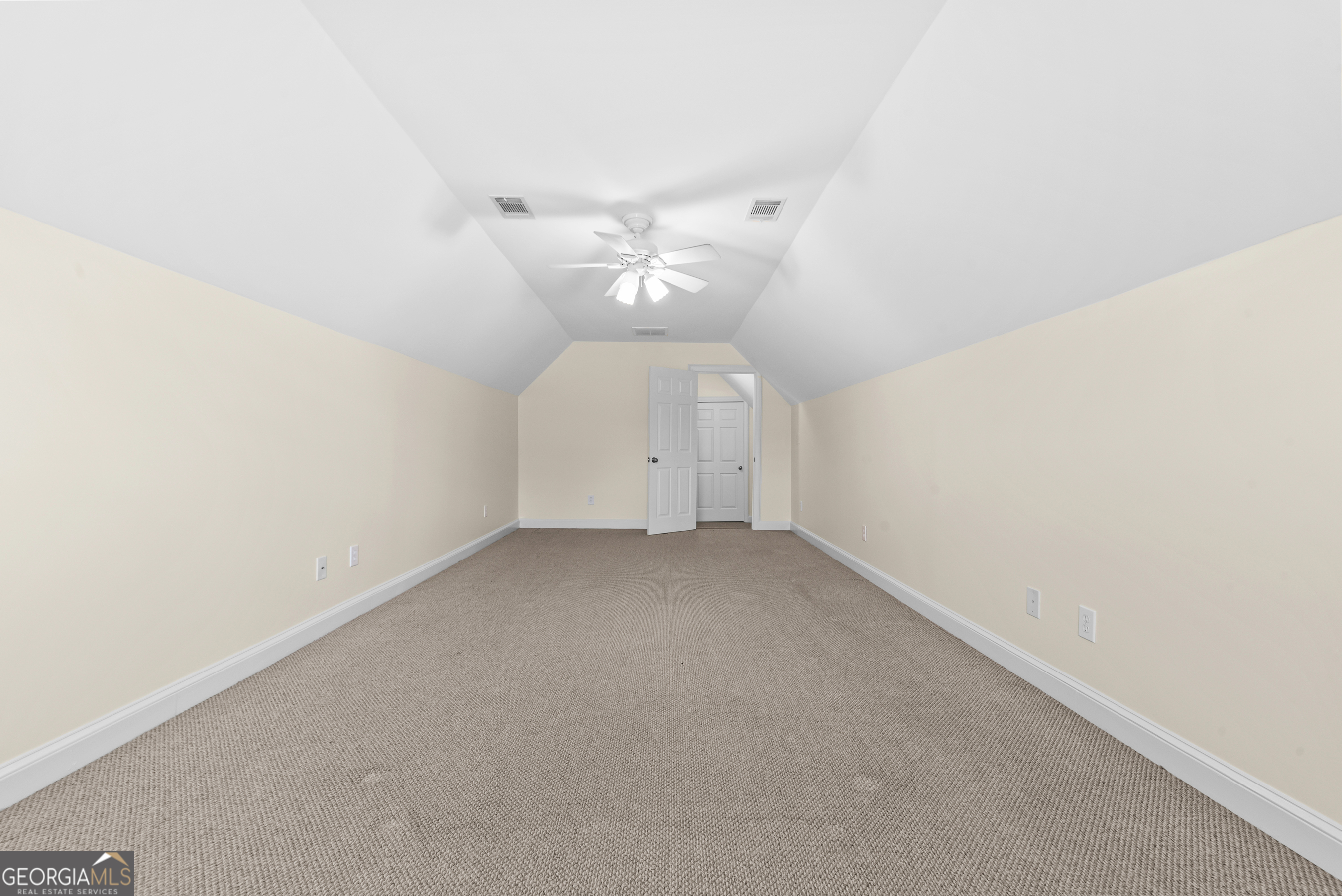 180 Cooper Road Social Circle, GA 30025 - Photo 36 of 51 an empty room with a ceiling fan and window