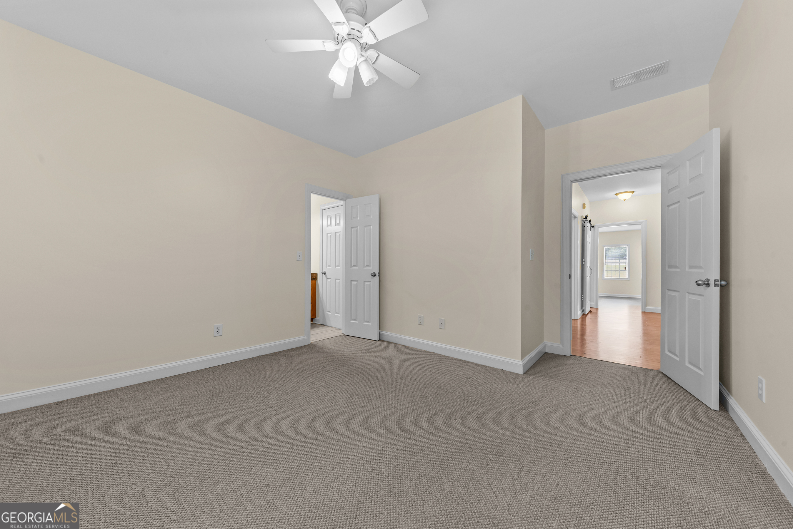 180 Cooper Road Social Circle, GA 30025 - Photo 38 of 51 a view of an empty room and chandelier fan