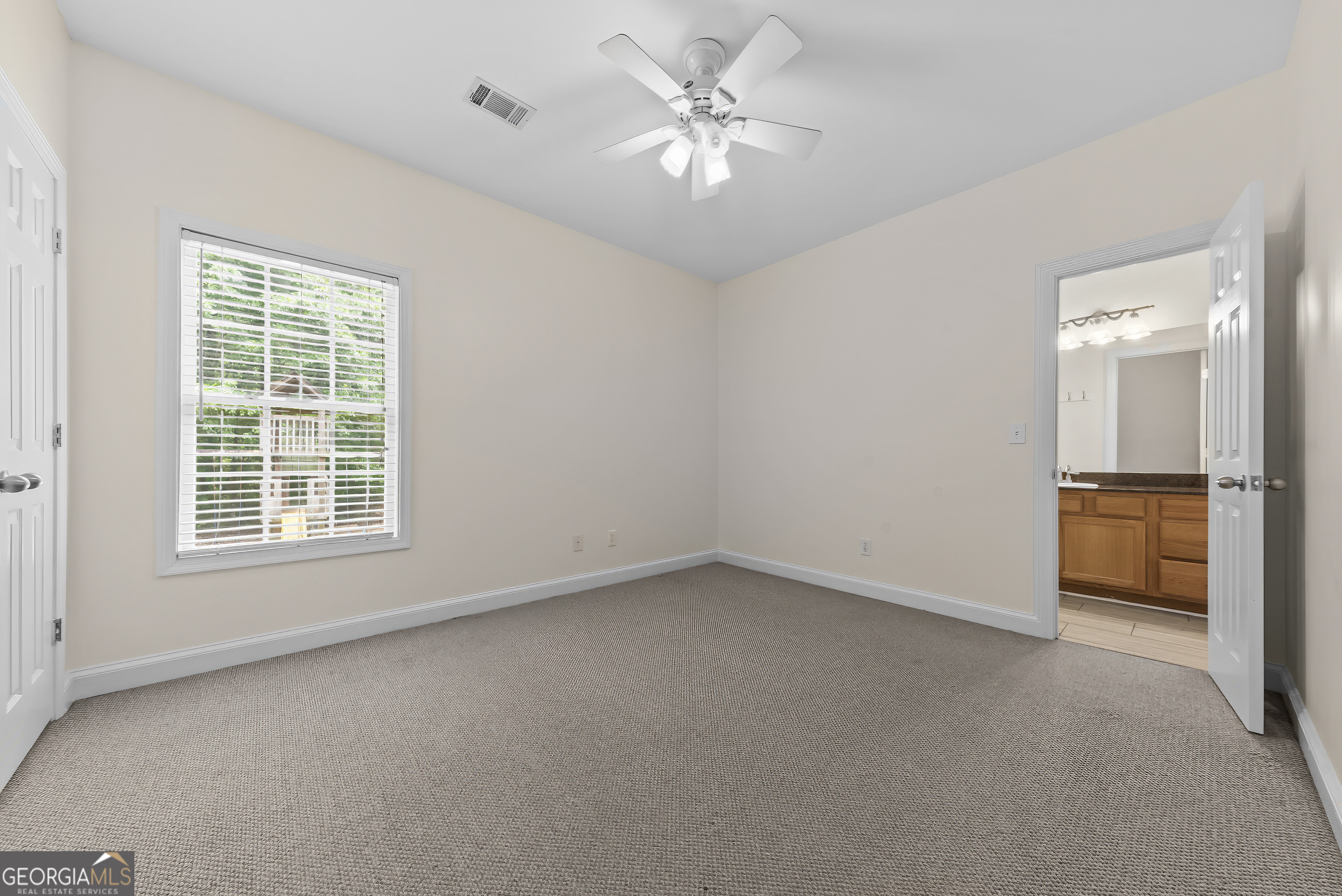 180 Cooper Road Social Circle, GA 30025 - Photo 39 of 51 a view of an empty room with a window