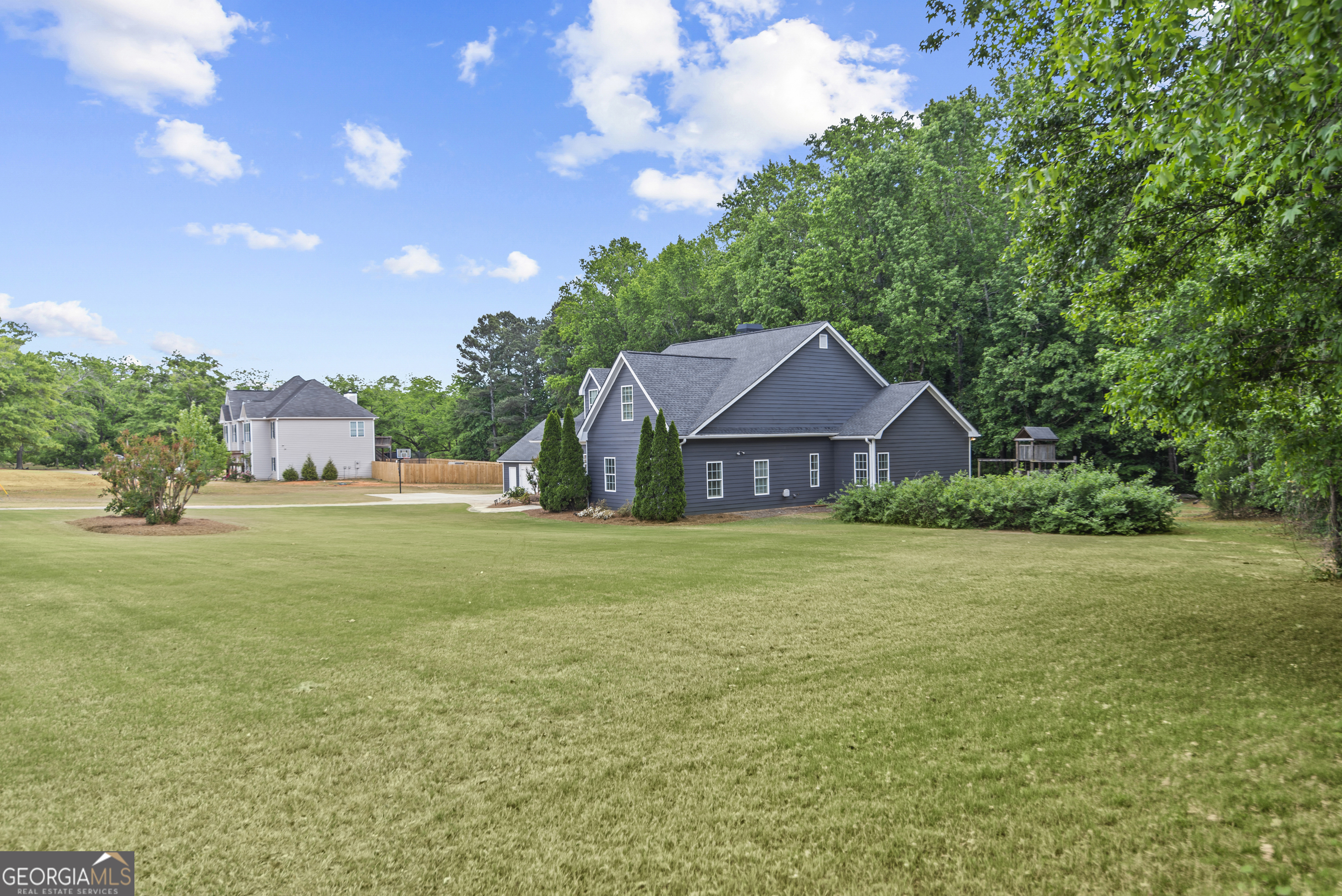 180 Cooper Road Social Circle, GA 30025 - Photo 50 of 51 a front view of a house with garden