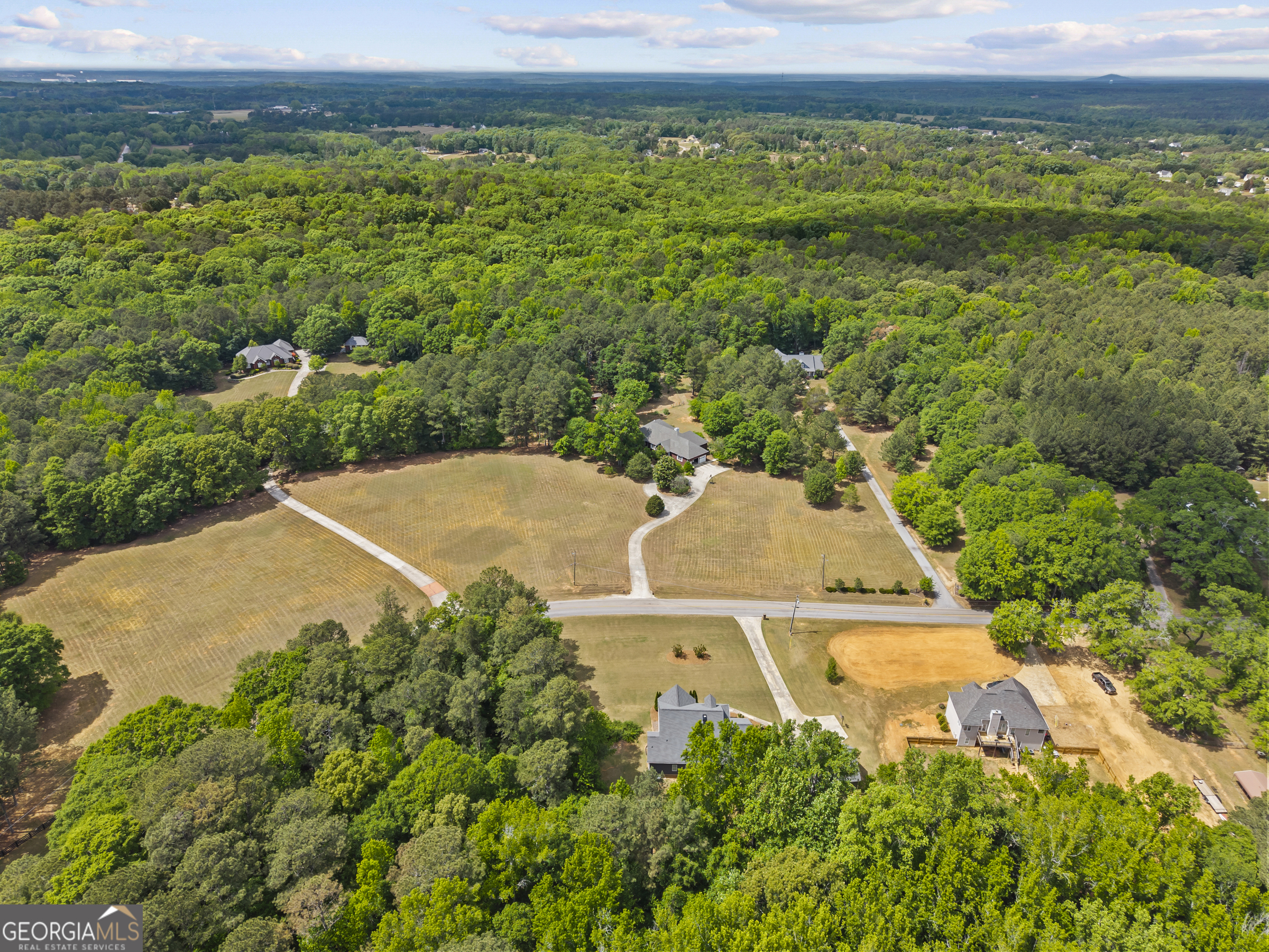 180 Cooper Road Social Circle, GA 30025 - Photo 5 of 51 an aerial view of a house with a yard