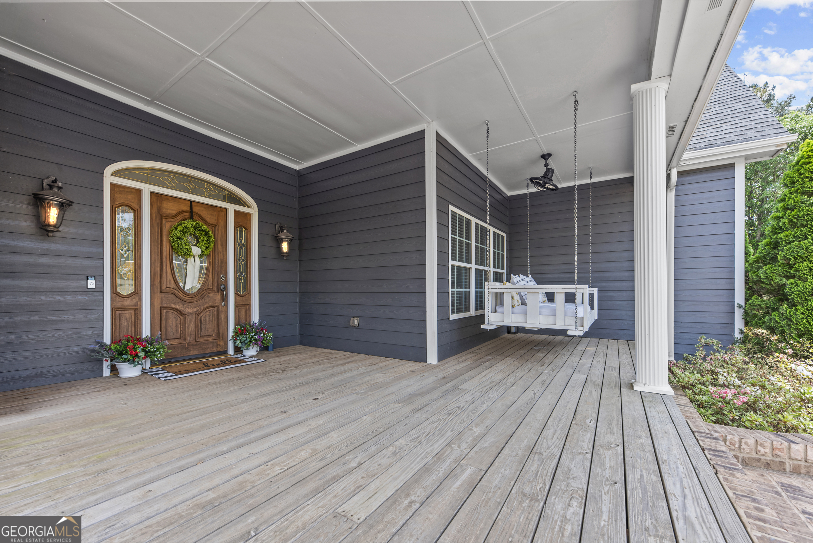 180 Cooper Road Social Circle, GA 30025 - Photo 10 of 51 a view of a house with porch and wooden floor