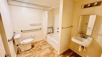 a bathroom with a tub and shower