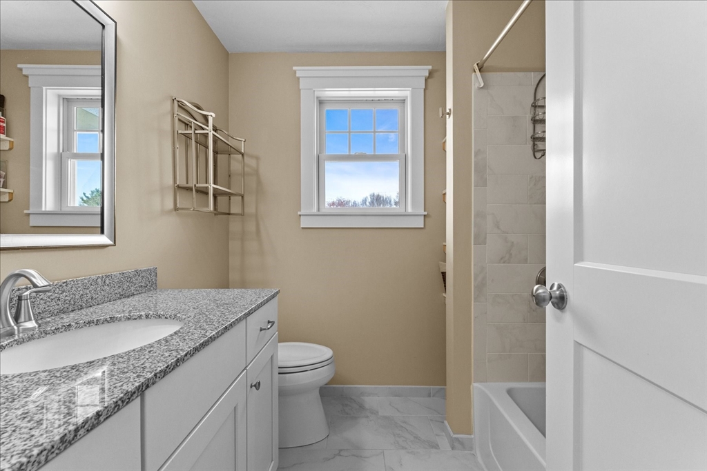 50 Quabbin Path Sutton, MA 01590 - Photo 29 of 42 a bathroom with a granite countertop sink toilet and shower